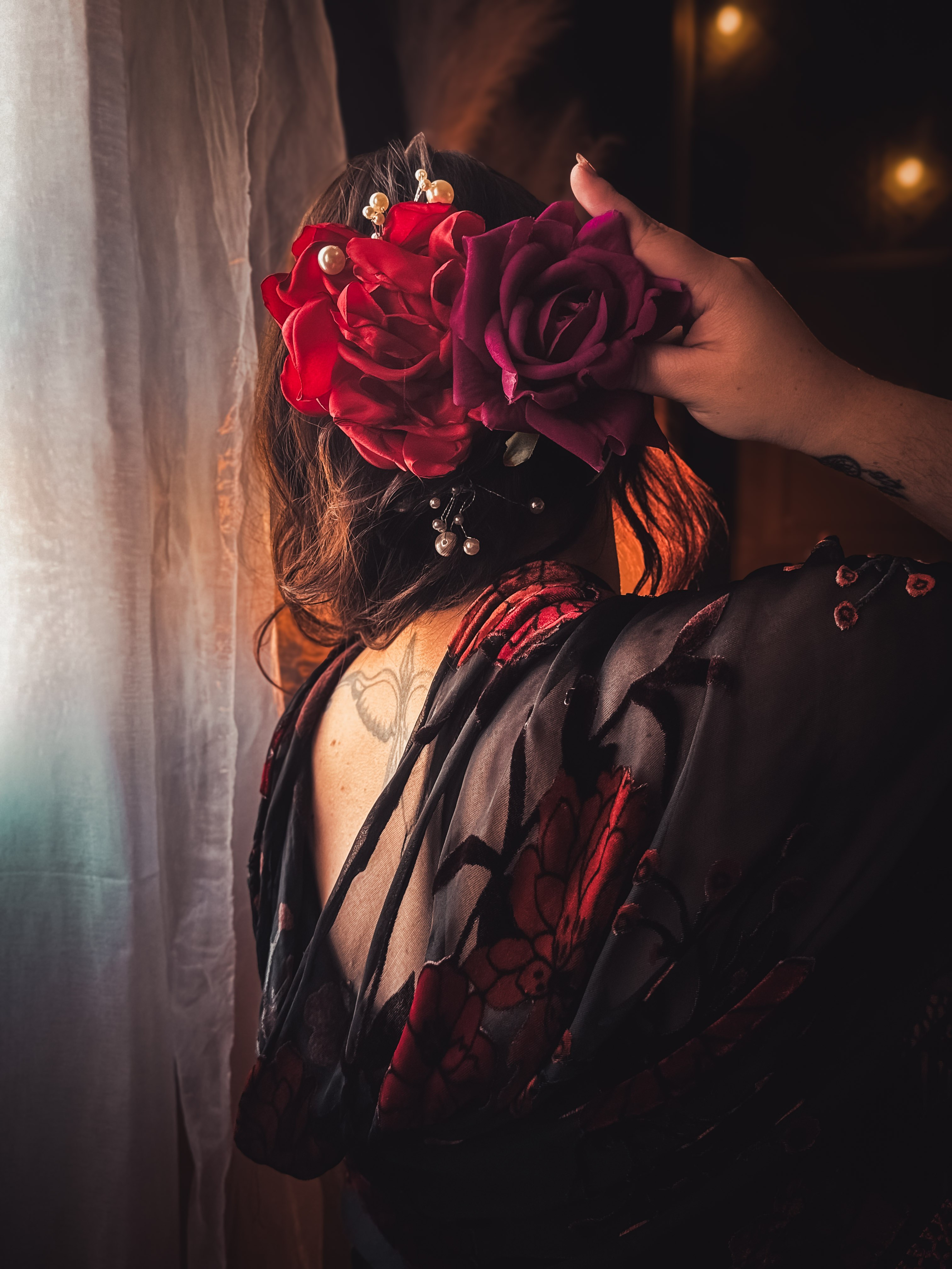 Red flowers and a black floral shawl